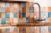 multi-colored tile backsplash in a kitchen