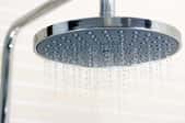 water dropping from large shower head