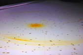 Orange burn marks on a white countertop.