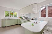 Kitchen with white laminate countertops