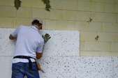 Person installing foam insulation sheets