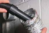 cleaning vent with vacuum hose