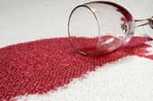 Glass of red wine spilt on carpet.