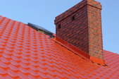 Roof flashing on a red roof.