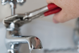 repairing a leaky faucet