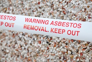 Safety tape that reads, "Warning Asbestos Removal, Keep Out"