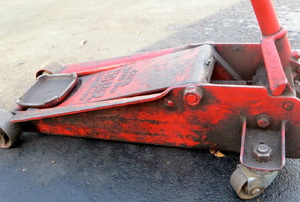 a red Floor Jack