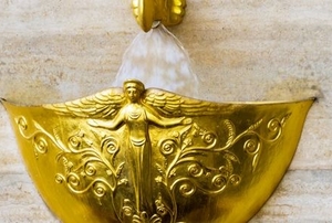 golden wall fountain with classical design