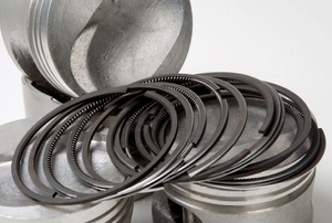 A group of piston rings laying spread out.
