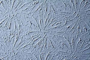 A close-up of the star-shaped pattern on a textured ceiling.