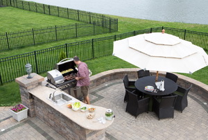 outdoor patio with kitchen, grill, and seating area