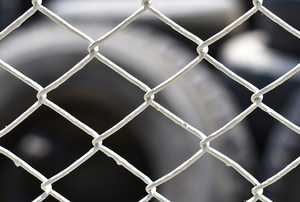 tightly stretched wire mesh fence