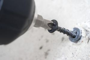 Removing a screw from a wall