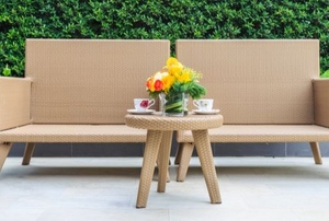 resin wicker chairs on a concrete patio