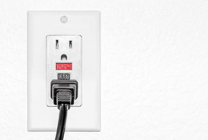 cord plugged into a white outlet