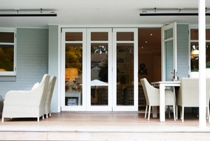 porch area with glass bifold doors and outdoor furniture