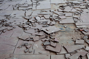 loosened, removed tiles with asbestos