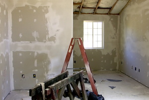 A room with drywall.