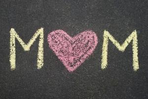 Mom written in chalk with a heart