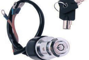 A motorcycle ignition switch and key on a white background.