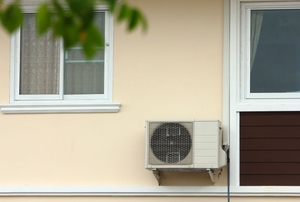 window AC unit mounted on outside wall