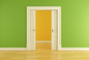 Double pocket door leading past a green wall into another room