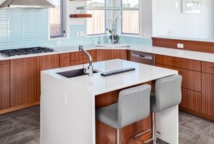 a small, clean kitchen with an island sink