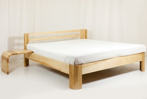 A modern bed with a wooden frame.