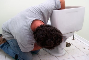 man installing a toilet