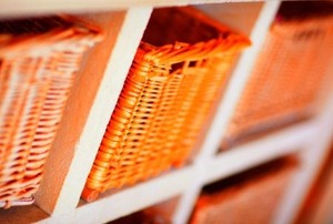 Baskets used as drawers for a simple storage solution.