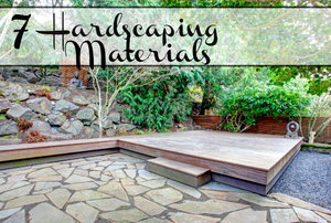 A yard landscaped in wood, stone, and tile with the words, "7 Hardscaping Materials."