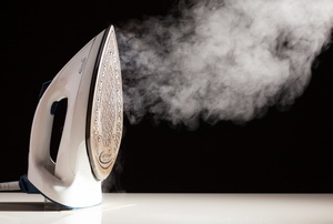 steam pouring out of an iron
