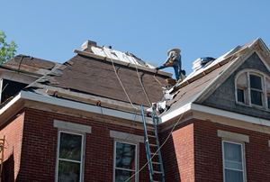 people working on a roof
