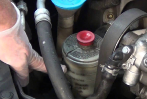 power steering reservoir in an engine
