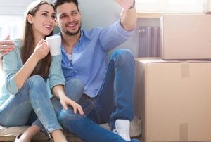 a couple with moving boxes