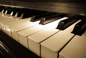 A close up on piano keys.