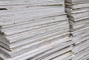 A large stack of drywall boards.