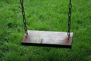 A wooden swing set.