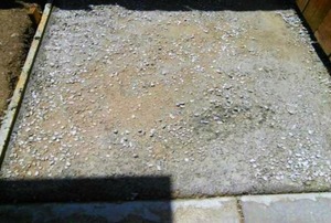 A badly poured concrete walkway.