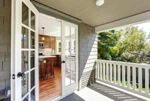 White French doors leading from a porch to a kitchen