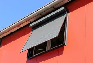 Sun shades on a red house.