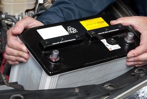 man removing car battery