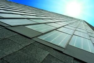 An array of solar shingles installed on a roof.