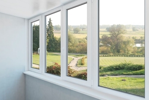 A set of four windows with vinyl frames.