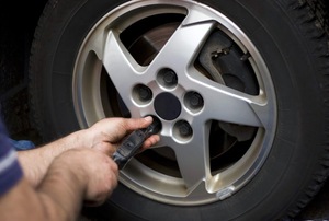 Working on a tire.