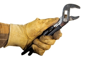 A hand in work gloves holding black-handled pliers.