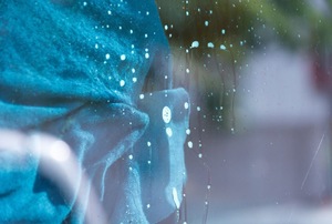 A glass window being cleaned.