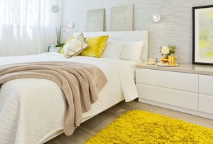 A feng shui bedroom with yellow accents