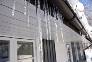 A house with icicles hanging from the gutter.