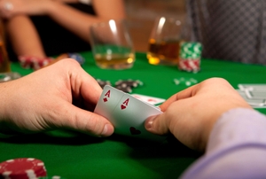 A group plays poker.